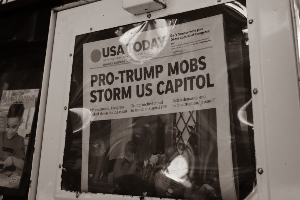 Newspaper headline about US Capitol attacks. Jan 7, 2021. Photo by little plant on Unsplash.